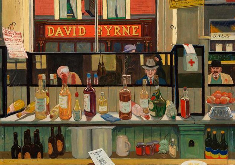 View of bottles and objects behind a bar with customers reflected in a mirror and a shop sign reading David Byrne visible through the window