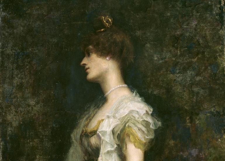 Portrait of Countess Markievicz in a cream dress against a dark background