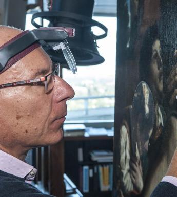 Simone Mancini, Head of Conservation at the National Gallery of Ireland, working on Guercino's 'Jacob Blessing the Sons of Joseph' in the J. Paul Getty Museum, Los Angeles. Photo © The Getty