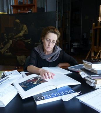 In preparation for conserving Jacob Blessing the Sons of Joseph, the Getty’s associate conservator Devi Ormond researches the history of the painting. Photo © Getty
