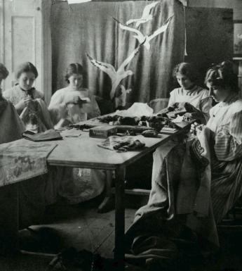 Vintage black and white photo of women sewing