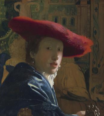 A woman in blue wearing a wide brimmed red hat looks over her shoulder, directly at the viewer. She is wearing pearl earrings, and the background has an intricate green and white pattern.