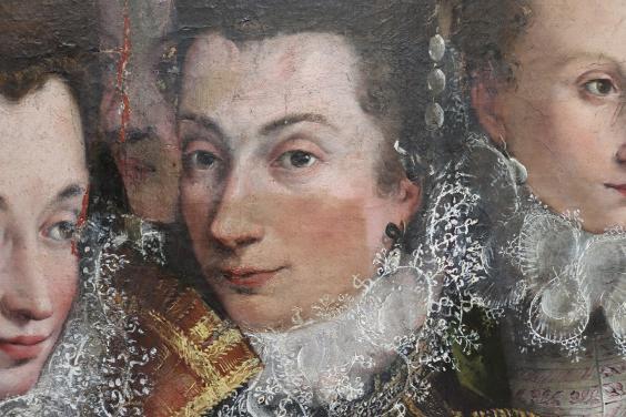 Areas of discoloured varnish removed from the upper parts of a painted face