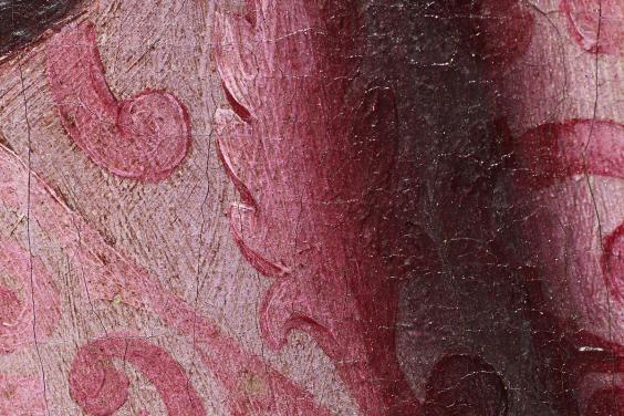 Detail of a painting showing pink brocade