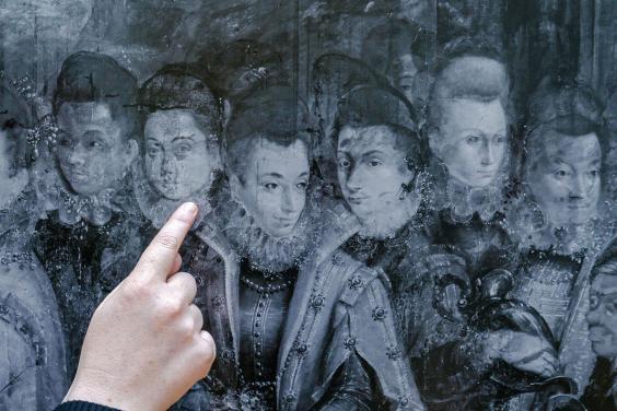 Hand point out pentimenti in a technical image of Fontana's painting