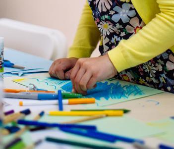 A child drawing during a drop-in family workshop at the Gallery.